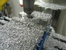 Next, it is time to start shaping the bracket  some creative clamping is sometimes needed to keep from flinging the piece across the garage (ask me how I know that!!).  Then some lightening slots to keep it from weighing the back of the car down: