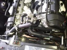 Installed upper and lower water hoses.