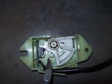 This illustrates the ratchet mechanism overextended.  No gap to the housing but most significant is the gap between the white stop tab and the notch to the right it is supposed to rest against.  Brake light stays on.