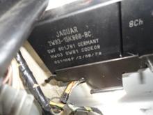 Second module in spare tire well on left rear corner