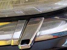 Original on Driver side - is the same depth as chrome. This is a plastic part