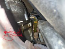 Laying down on my back looking up. Left hand side of the car. Right above the exhaust. Any one know what it is? Is that even coolant or green mineral oil for power steering?