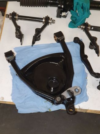 Custom spring pan to facilitate adjustable front springs.