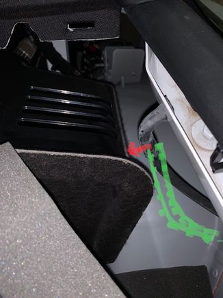The rear side window drains can rattle against the plastic part as shown by the red arrow. One of my sides was clipped into a holder right at the very bottom and will be held taught and away from the contact point as shown in the photo. My other drain was just hanging loose which then lies in the path of the green dots and can rattle. It is hard to put the loose end back into the clip as it is right down the bottom and you are doing it blind and by feel only and you don’t want to create a kink.