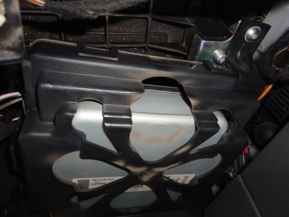 I am still assuming that this module under the glove box is the ECM?  At the top of the photo appears to be the underside of insulation? I only see one six point torx and one Phillips.