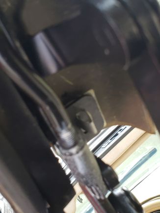Push type fastener, end-most on side of panel/cover.