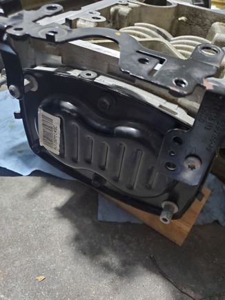 Drain plug on top (just above black panel) and offset a bit to the left