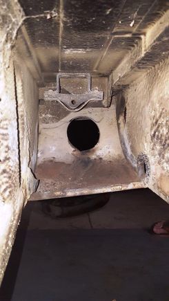 (above) View from where rear muffler sits out the exhaust hole opening.  Ledge below hole was full of rocks and dirt.  Don't believe that was from me (below)