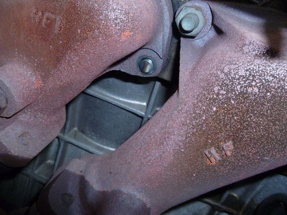 broken exhaust stud and missing nut