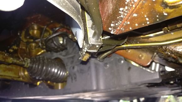 Camera position right behind left front wheel looking forward in 45 degree angle. The brownish stuff is the anti-corrotion material.