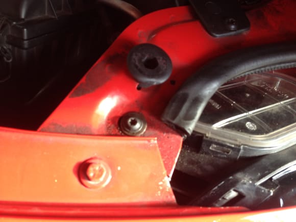 Completely remove Torx bolt from above headlamp