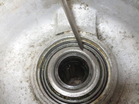 Bearing fully drifted into place. It is the space bewteen the bearing (pointer on it) and the hub tube (inside the bearing below it) that the spacer is requied for