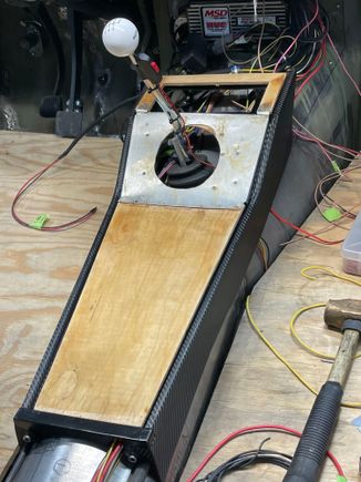 Shifter hole cut, covering the wood in leather.  Will attempt a leather boot.