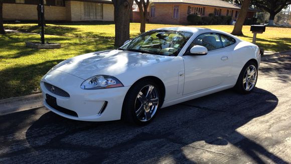 Thought I would add this pic since I haven't seen too many white XKs and none with the chrome wheels.  I didn't anticipate liking this car when I went to look at it, but was driving it home two hours later...