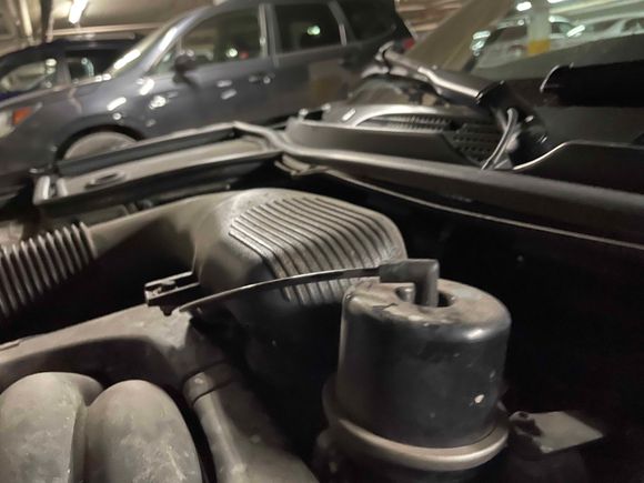 Cap on APP. Vacuum tube point forward. Remove tube and spray cleaner into cap. A fine spray tube helps. It will take only a small amount. Careful - the cleaner is very flammable. Do not do in a hot engine.