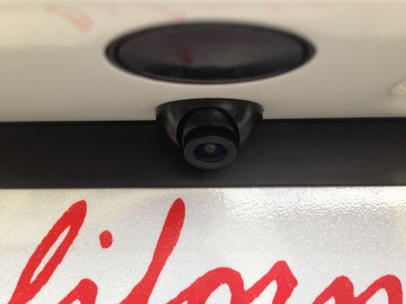 there's the tiny camera. smaller than trunk pop button