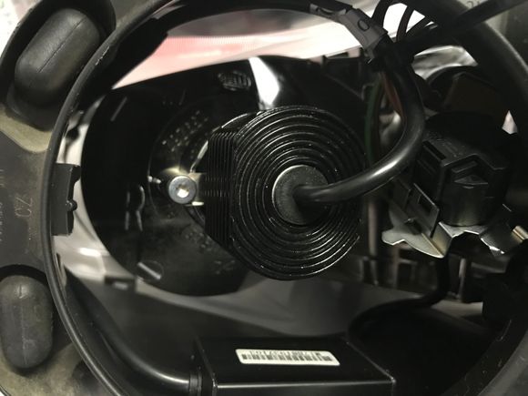 The cables were routed around the top of the outside of the high beam reflector. The other cables were bunched together and tied with a single plastic tie, also provided with the kit.