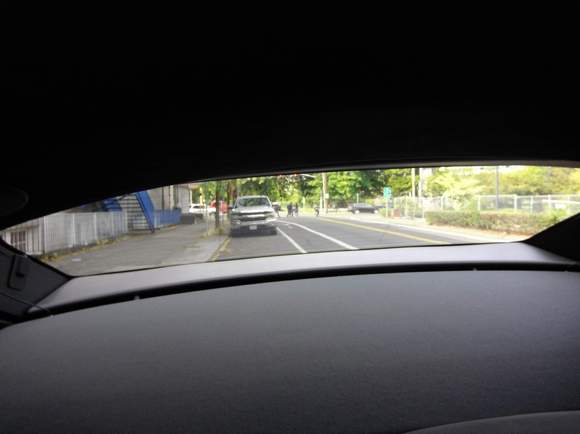 Plan on using your side mirrors, rear window is tiny.  