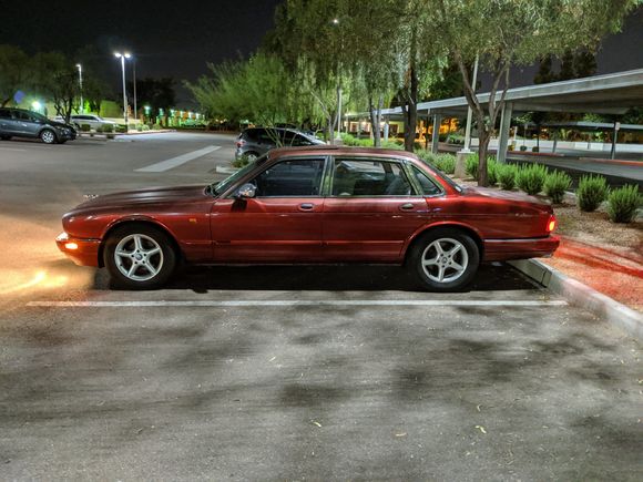 1996 XJ6 in Carnival Red with new aftermarket wheels.