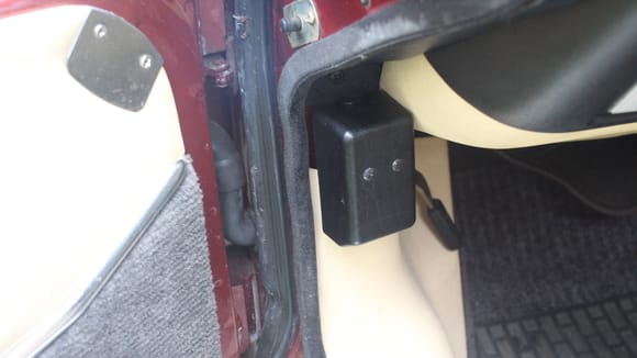 This is the 'Cut Out' that shuts the Car down in the event of an accident.
Push the blunt end of a pencil down the hole of this cover in order to Push down the Button Inside and re-lock it.
