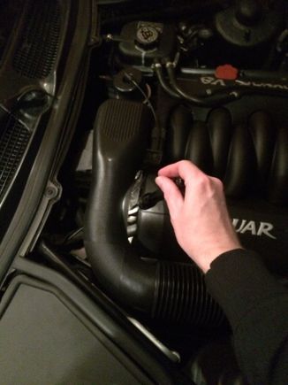 This is the general location of the vacuum T-fitting on the passenger side at the back of the engine bay