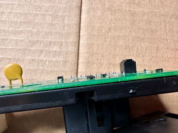 This is the actual underlying button. When pressed the top 2 layers are flush with the 3rd layer. The button is spring loaded and does not stat in when pressed