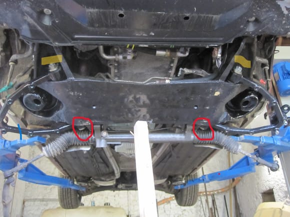 Catsellated nuts marked in brown, the other end of the fulcrum pin in red. NOTE the subframe has to be swung down and the steering rack removed to renew the pins and bushes