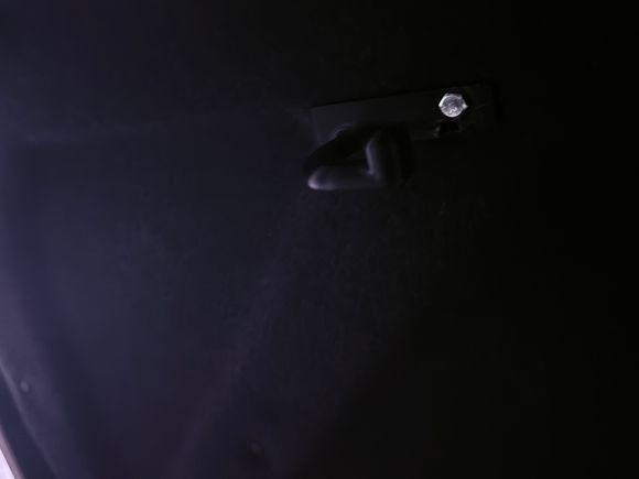 It goes here... (replaces left panel rivet on the inside of the trunk lid).