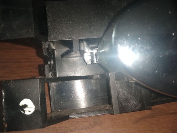 You can see where the metal broke at the point of cable attachment.