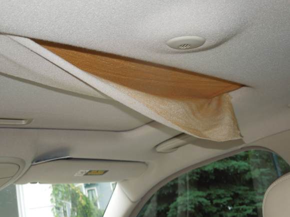 Drooping sunroof headliner fabric, early June.