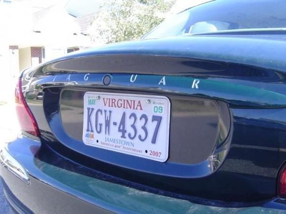 Closeup of the "Jaguar" in the trim above the license plate.  Pretty easy to do.  Note, the letters are part of the trim, not the normal "stick on" lettering elsewhere.
