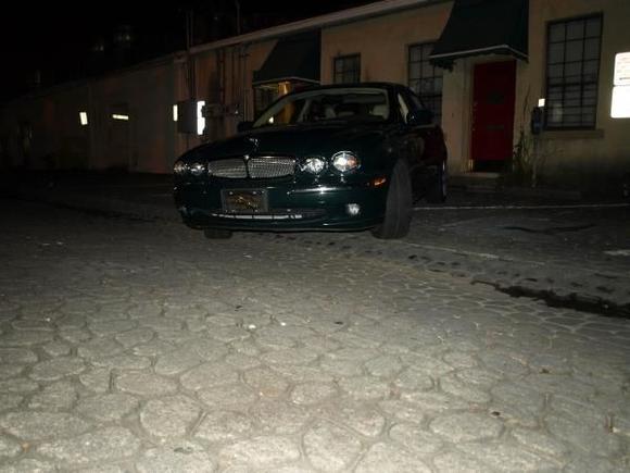 My 2004 X-type in Savannah on a backroad on River street at night.