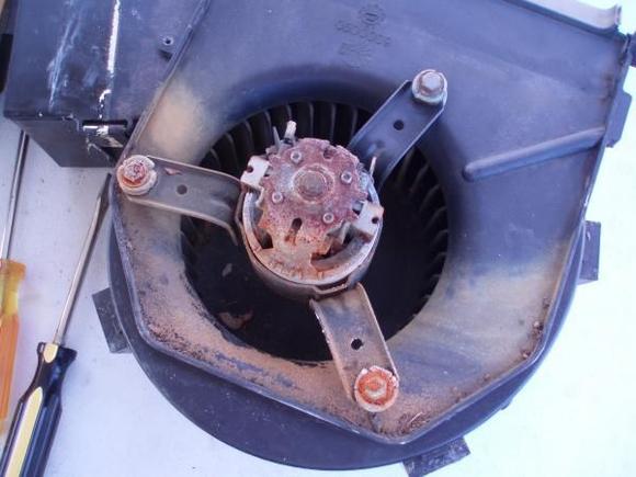 Blower assembly taken apart.  Note rust/corrosion from water ingress.