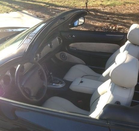 image we oatmeal leather interior. Leather seats and console with black stitching and piping and matching suede door inserts.