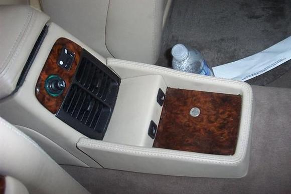 Rear seat console with heated seat pushbuttons.