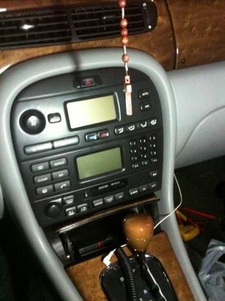 Stock head unit... tape player setup, the white wire is the tape converter that I brought through the glove box to hook up to my IPhone and IPod for music.
