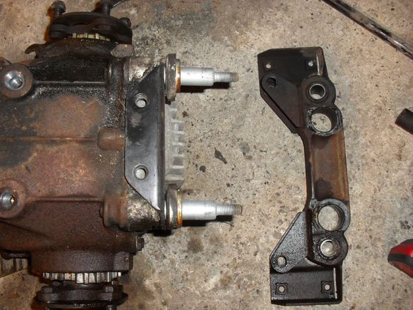 The support bracket on my 1998 convertible.  The second parts diagram in your post looks like they modified this part and did away with the washers.