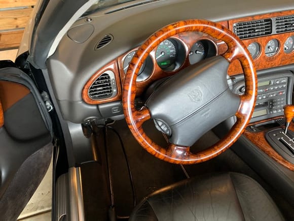 Myrtle steering wheel, new dash wood behind it and on console.