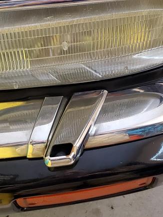 Original on Driver side - is the same depth as chrome. This is a plastic part