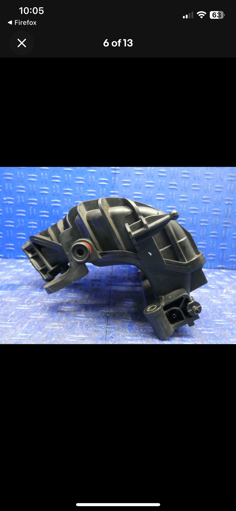 The connection is to the right of the manifold.