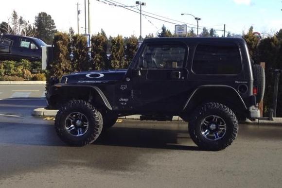 New tires! and if I can get the other pics resized of all the other stuff Ive added they will be put up too! Bushwacker Flatties Smittybilt XRC Front bumper and Smittybilt XRC8000lbs winch