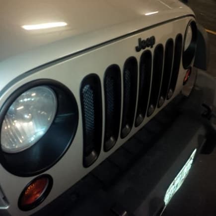 New Jeep logo, light bezel inserts and grill inserts. Front end looks so much better now. NOTHING shiny allowed.