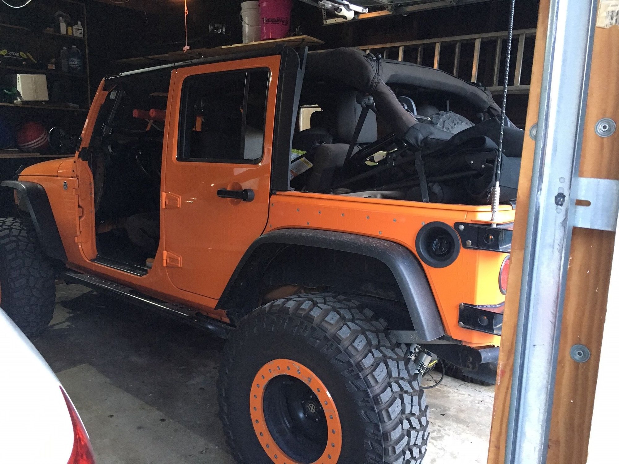 2012 Jeep Wrangler - Feeler - Looking to Sell 2012 JKU - Used - VIN 49238409j3fjfh2f0 - 66,000 Miles - 6 cyl - 4WD - Automatic - SUV - Orange - Davenport, IA 52803, United States