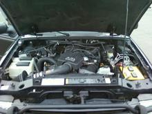 Has the biggest engine available; the 4.0L V6.  Made by Ford, but has lots of power. (I spun my tires and whipped the tail end around once by accident on wet pavement, misjudged throttle response a little there... :O, lol)  I get about 17 mpg in 2-wheel. 19 once.....