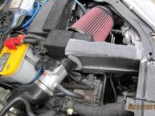 K&amp;N SRI=CAI 
Sealed from Hot Engine Compartment allows only Colder fresher air to get in.  I also later installed a water deflector shield in front of tire area to prevent splash up from puddles.