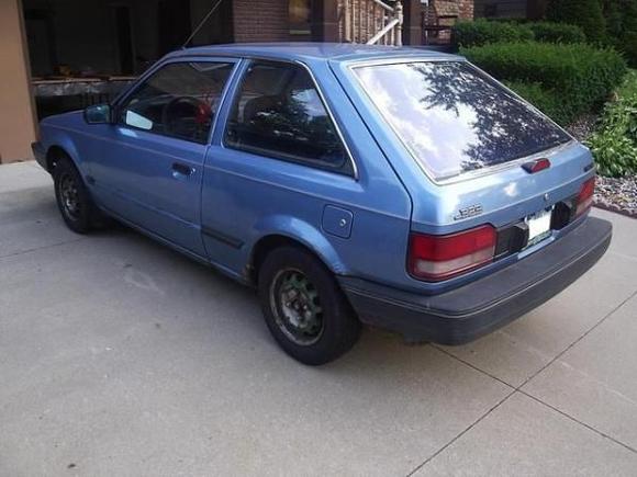 1986 Mazda 323 DX (not my actual car)
DX stands for De Luxe. I never figured out how it deserved this designation. No A/C, hand cranked windows, 5 speed manual, form 1986 to 1995 and 105000 miles. The longest trip we did was with 4 adults from Iowa to Toronto to Pennsylvania to North Carolina and back to Iowa. We kept a fly swatter handy because if you have no AC you have no other way to get rid of these critters. It was the most reliable vehicle I ever had because what you don't have doesn't brake. And because I liked it so much I bought the Protege as secondary vehicle.