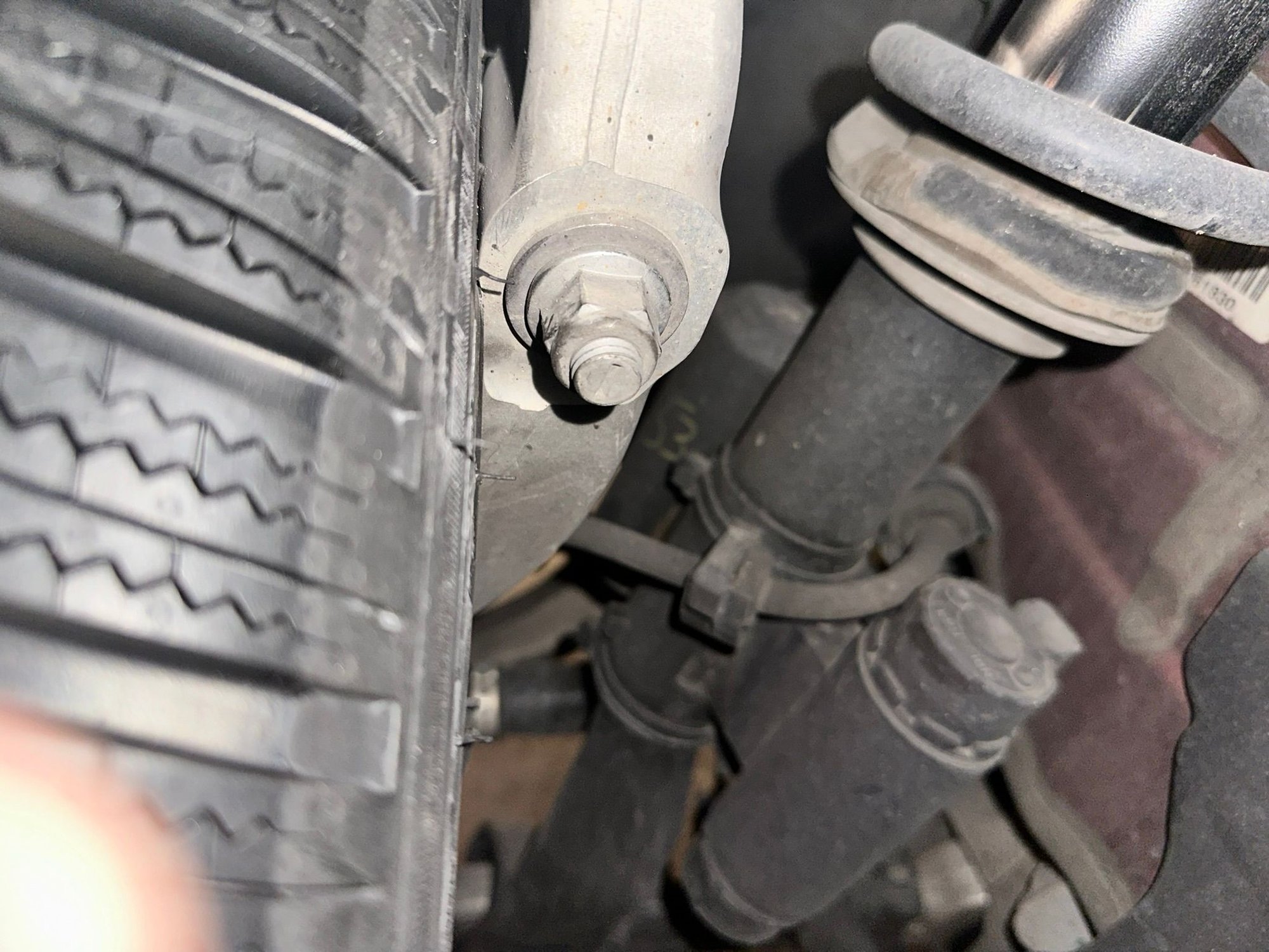 -1 mm clearance between the steering knuckle and tyre side wall of the proposed J8.5 ET35 235/40-R19 wheel.