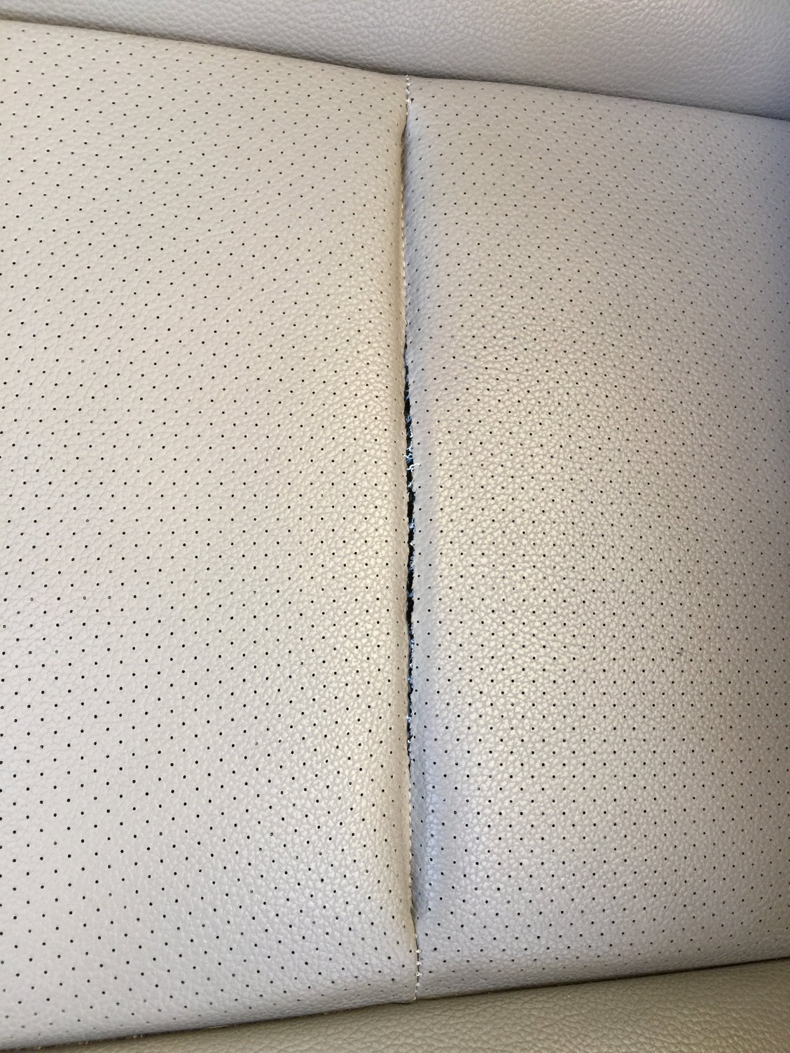 how to repair ripped car seat. It's a pretty big tear and it's perforated  leather (i think). Not sure what to do as I definitely don't have $100+ to  throw away on