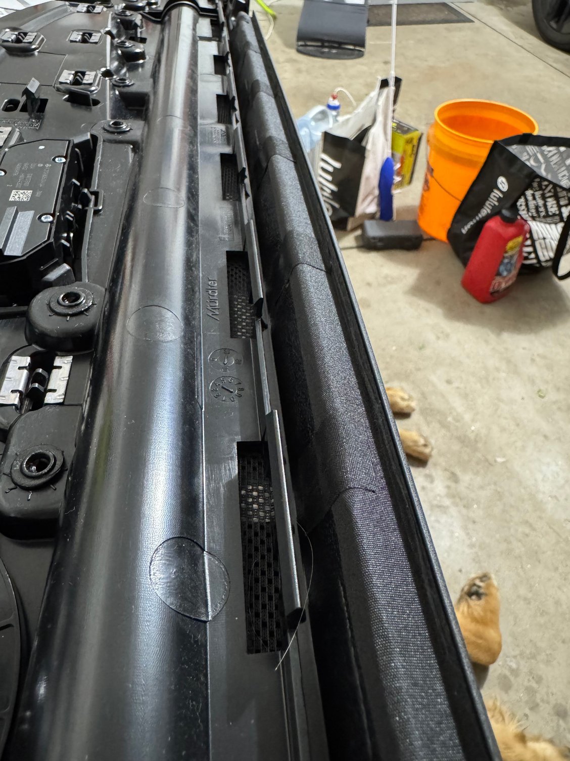 I put window weld in each of the clips, really shoving it down in there, and layered tesa tape over the long gap. Used a pick to push the tape somewhat into the crease. Afterwards, no noise!