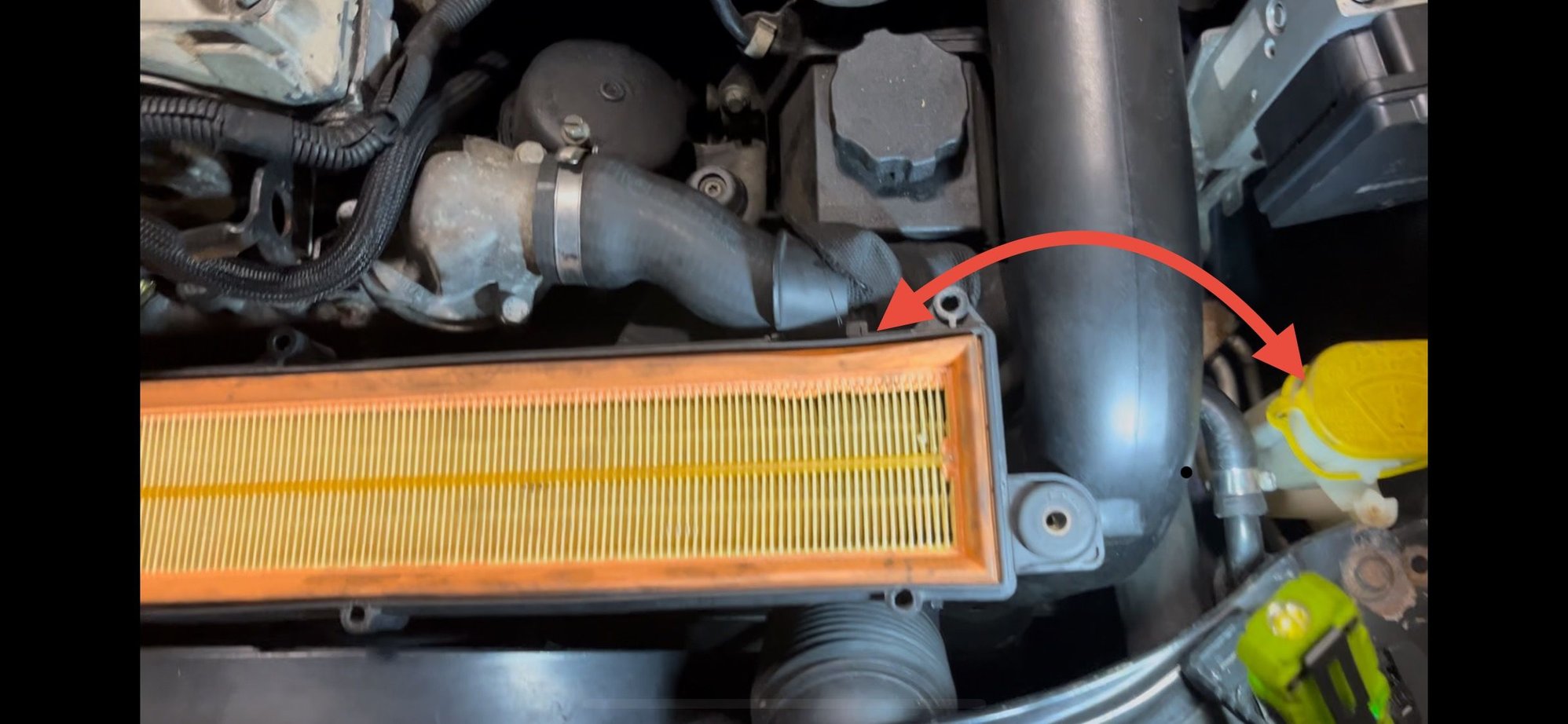 Facing front engine bay, (US) drivers� side, near filter box